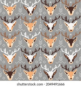 Vector illustration of festive Christmas theme pattern with heads of reindeers and ornaments on grey background