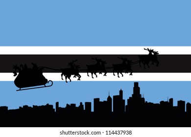Vector Illustration of the flag of Botswana with santa flying his sliegh over a city