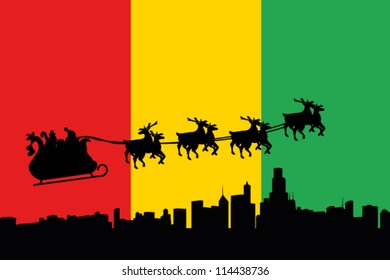 Vector Illustration of the flag of Guinea with santa flying his sliegh over a city