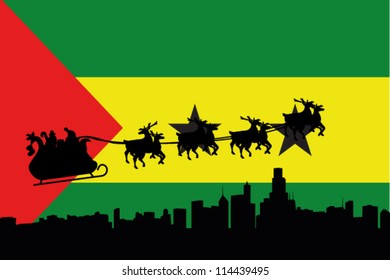 Vector Illustration of the flag of Sao Tome E Principe with santa flying his sliegh over a city