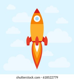 Vector Illustration: Flat Icon With Yellow And Red Rocket Ship
 Isolated On Light Blue Background With White Clouds. Project Start Up And Development Process. Innovation Product And Management