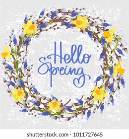 Vector illustration with floral frame with pussy willow, crocus, snowdrops, narcissus and hyacinth. Handmade calligraphy and text Hello spring.