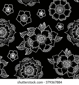 Vector illustration of floral seamless. White isolated flowers on a black background.