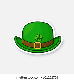 Vector illustration. Front view of bowler hat with buckle and clover. Saint Patrick's Day symbol. Sticker cartoon style with contour. Decoration for greeting cards, patches, prints for clothes, badges