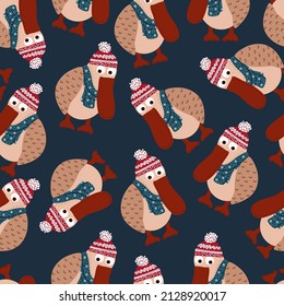 Imagen vectorial de un pájaro gracioso vestido de invierno. Patrón sin foco, pájaro gracioso con un pico rojo en un sombrero de invierno. Embalaje navideño