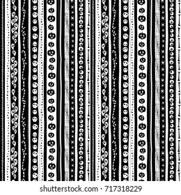 Vector illustration Funny cute scary black and white seamless background abstract pattern for halloween party with pumpkin, candy, ghost, spider, scull and bones. Flat silhouette style