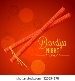 Vector Illustration of Garba Dancing Sticks with Happy Navratri text with effects for Navratri.