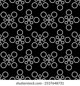 Vector illustration. Geometric seamless pattern. The solid dots and linear circles in the rows form a rhombus shape. Spotted grey, black and white background. Simple monochrome abstract pattern.