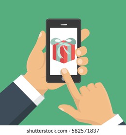 Vector illustration. Gift app page on smartphone screen. Hand hold smartphone. Mobile concept for web banners, web sites, infographics. 
