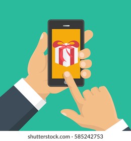 Vector illustration. Gift app page on smartphone screen. Hand hold smartphone. Mobile concept for web banners, web sites, infographics. 
