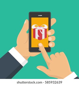 Vector illustration. Gift app page on smartphone screen. Hand hold smartphone. Mobile concept for web banners, web sites, infographics. 
