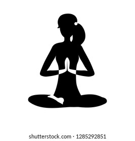 Vector illustration The girl is engaged in yoga and calm down. Black silhouette of a slim woman meditating in lotus pose isolated on white. Motivational card, poster design for practice.