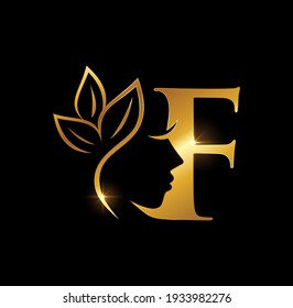 Eine Vektorgrafik des ersten Buchstabens F der goldenen Schönheit auf schwarzem Hintergrund mit goldenem glänzendem Effekt