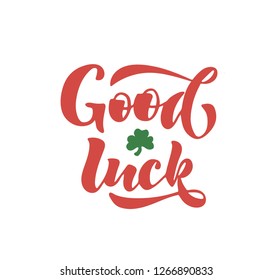 Vector illustration of "good luck" text in an elegant orange font, decorated with a shamrock siutable for clothes print or postcards, wishing luck.