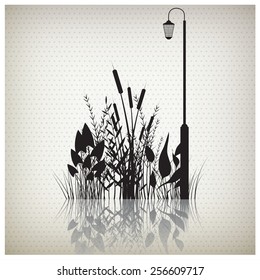 Vector illustration of a grass black silhouette with a street lamp 