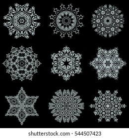 Vector illustration in gray colors on black background. 9 snowflakes winter New Year frame.