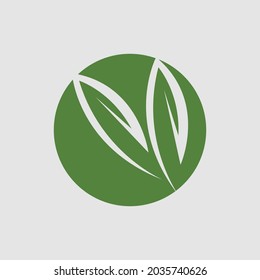 vector illustration of green leaf logo design at background gray