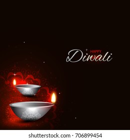 Vector illustration or greeting card for Diwali festival with Diwali elements.