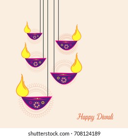 Vector illustration or greeting card for Diwali festival with Diwali elements.