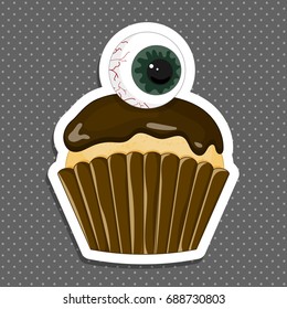 Vector illustration of a Halloween purple cupcake sticker. Happy Halloween scary sweets. Sweet big eyes.
