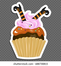 Vector illustration of a Halloween purple cupcake sticker. Happy Halloween scary sweets. Sweet boots witch.