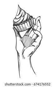 Vector illustration of a hand with cake in hand drawn vintage engraving style on white background.