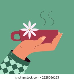vector illustration with hand and cup of hot chamomile tea