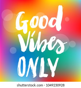 Vector illustration of hand drawn brush lettering quote Good Vibes Only on bright blurred background for card, print, poster