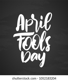 Vector illustration: Hand drawn brush type lettering of April Fools Day on chalkboard background. 