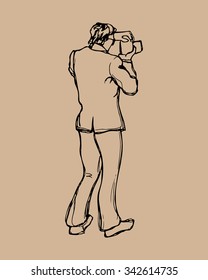 Vector illustration of a hand drawn male photographer. Beautiful ink drawing.