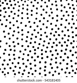 Vector illustration of hand drawn seamless pattern. Black dots isolated on white background.