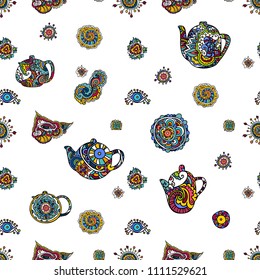 Vector illustration. The hand draws on a graphic tablet. Seamless illustration consisting of Indian ornaments and a set of colorful teapots.