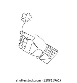 Vector illustration of a hand holding a clover leaf