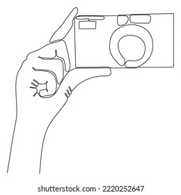 
Vector Illustration of Hand Holding Digital Camera - continuous line drawing