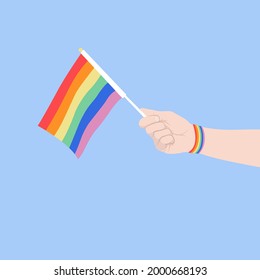  vector illustration hand holding LGBT flag, same-sex love concept