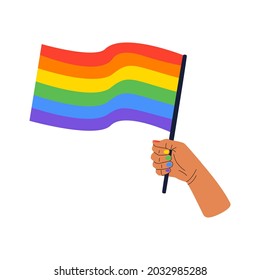 Vector illustration of a hand holding a rainbow flag, a symbol of the LGBT community. The concept of celebrating the International Day against Homophobia. The pride flag isolated on a white background