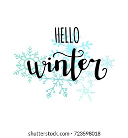 Vector illustration with hand lettering and hand drawn doodle snowflakes Hello winter. Modern brush pen calligraphy on white background. Handwritten phrase for seasonal poster, card, banner design.
