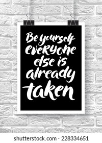 Vector illustration with hand-drawn words on brick background. "Be yourself everyone else is already taken" poster or postcard. Calligraphic and typographic inscription on chalk blackboard