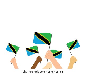 Vector illustration of hands holding Tanzania flags on white background 