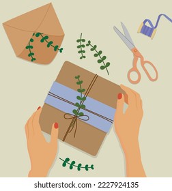 Vector illustration of hands wrapping a gift for the holiday