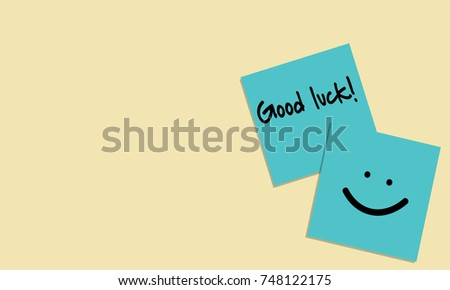 Vector illustration of handwriting of message "Good luck!" and smile face on blue sticky note on yellow background. Vector illustration background.