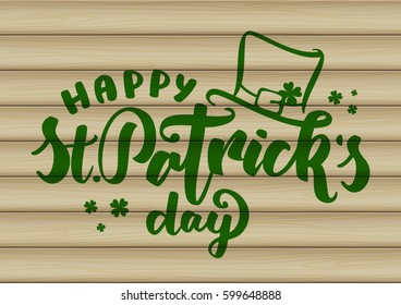Vector illustration: Handwritten  lettering of Happy St. Patrick's Day with leprechaun hat on wood background.  
