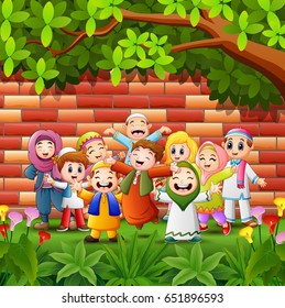 Vector illustration of Happy cartoon kid celebrate eid mubarak with brick wall background