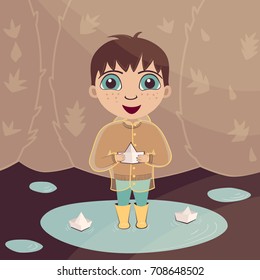 Vector illustration of a happy little boy in rubber boots and a raincoat with paper boats in a puddle