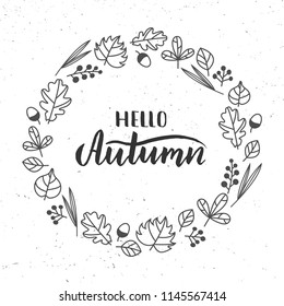 Vector illustration of "Hello autumn" hand drawn lettering, decorated by handrawn wreath. Beautiful graphic design for cards, postcards, invitations, banners, posters. EPS 10