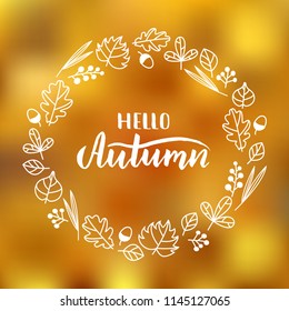 Vector illustration of "Hello autumn" lettering on colorful gradient background of yellow leaves. Hand drawn wreath of autumn leaves and berries. EPS 10