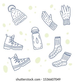 Vector illustration of hiking or touristic equipment. Warm hat, wool socks, gloves, trekking shoes, bottle of water. Set of icons. Doodle handdrawn style. 