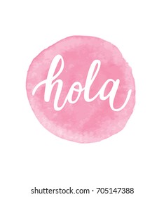 Vector illustration of 'Hola' calligraphy, Spanish translation of Hello phrase. Hand lettering in pink circle.