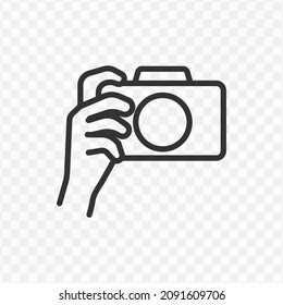 Vector Illustration Of Hold The Camera Icon In Dark Color And Transparent Background(png).