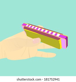 vector illustration of human hand holding a colorful harmonica